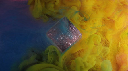 Mixing tone. Color spill splash. Bright yellow blue flow smoke glitter purple cube cloud paint ink mist texture on abstract art light background.の写真素材