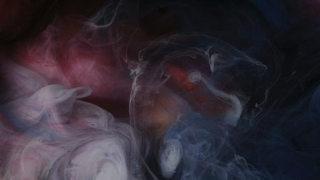 Sparkling storm. Paint fog texture. Defocused white red blue color glowing splash ink haze smoke fume on abstract art dark black background.の写真素材