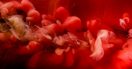 Smoke texture. Flame splash. Defocused red color liquid underwater swirling acrylic paint flow on abstract art background.の写真素材