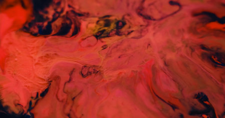 Acrylic blend. Blur drip marble. Defocused orange red pink color water liquid flow fluid ink on abstract art bright wet background.の写真素材