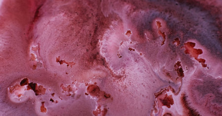 Shimmer fluid. Ink particles. Defocused pink maroon bronze color water glitter liquid flowing on abstract art creative background.の写真素材