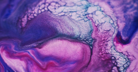 Defocused paint. Wet ink. Blur purple blue red color water liquid enamel acrylic ripple texture spreading on abstract art background.の写真素材