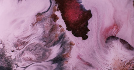 Mix paint. Ink flow. Defocused red bronze brown color acrylic liquid fluid wet pigment spreading on abstract art creative background.の写真素材