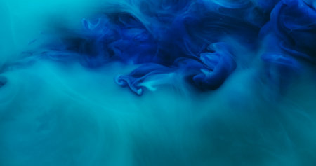 Blend flow. Atmospheric smoke. Defocused blue color ink in water fume swirling fog pigment spreading...