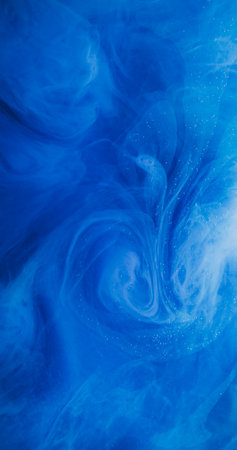 Spreading wave. Color fluid. Defocused blue liquid swirling acrylic pigment vapor soaring on...
