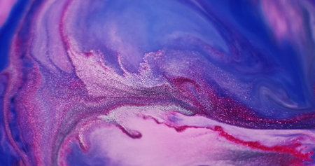 Liquid marble texture. Ripple fluid. Defocused blue purple red color ink in acrylic water crimson...