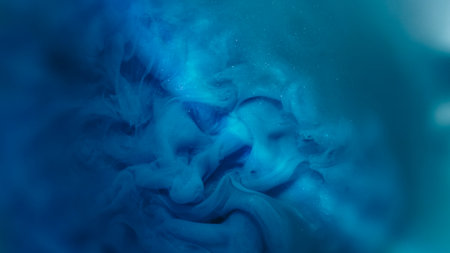 Paint flow. Cloud texture. Defocused blue purple color sparkling rainbow splash water particles...