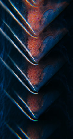 Ink spill. Rainbow triangle. Defocused orange blue neon color sparkling particles flow water...