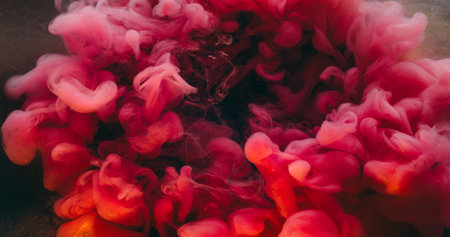Pink swirl ink. Wave texture. Defocused vibrant color glitter shiny vapor liquid floating on abstract creative underwater background.の写真素材