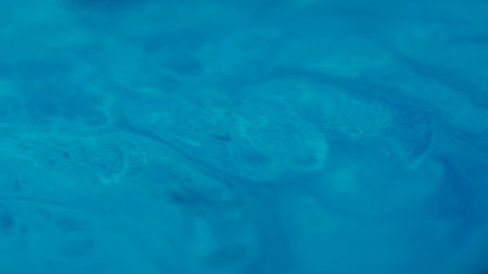 Splash marble. Abstract paint. Defocused blue color ripple chemical texture water emulsion fluid liquid floating on art background.の写真素材