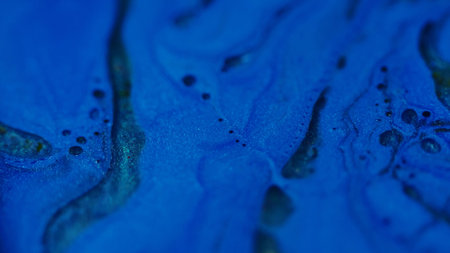 Bubble paint. Blob flow. Defocused blue cyan color pigment round oil water liquid molecular fluid moving on abstract art background.の写真素材
