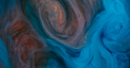 Ink blend. Swirl haze. Defocused blue orange colorful sparkling vortex splash glitter texture on abstract underwater art background.の写真素材