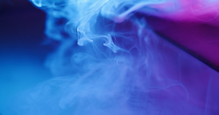 Fluorescent vapor. Smoke cloud. Blur blue purple neon color paint splash acrylic underwater glass texture spreading on abstract background.の写真素材