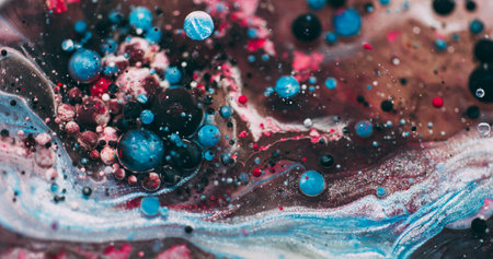 Color bubbles. Paint oil pigment. Defocused blue pink emulsion fluid dark black mix liquid round floating on abstract art background.の写真素材