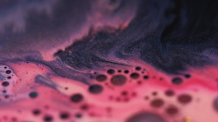 Shimmer art. Oil texture. Defocused pink purple color paint in water marble sparkling liquid droplet...