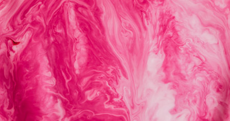 Paint spill defocused. Ink spread. Color bright dye abstract curl flow on acrylic texture. Pink wave stream on white art background.の写真素材