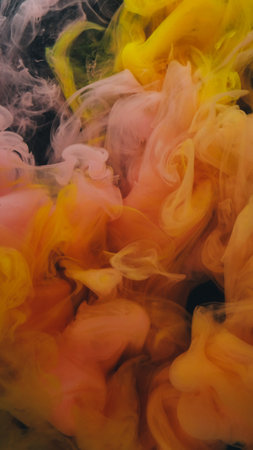 Flowing fog. Vapor background. Defocused yellow pink color paint in liquid water chemical fluid...