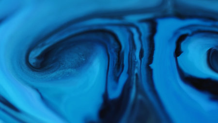 Ink water. Chemical fluid. Defocused blue neon color paint enamel marble wet texture emulsion growing on abstract art creative background.の写真素材