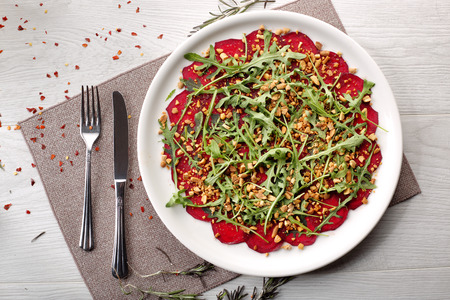 beets with peanuts on white wooden background, breakfastの写真素材