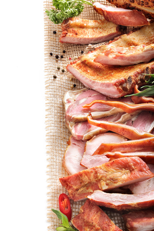 Assortment of bacon and ham on a white background Still lifeの写真素材