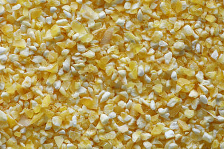 uncooked coarse cornmeal close up background top viewの写真素材