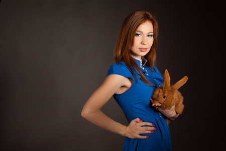 portrait of a beautiful woman with a rabbitの写真素材