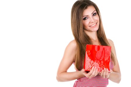 Portrait of beautiful young woman with giftの写真素材