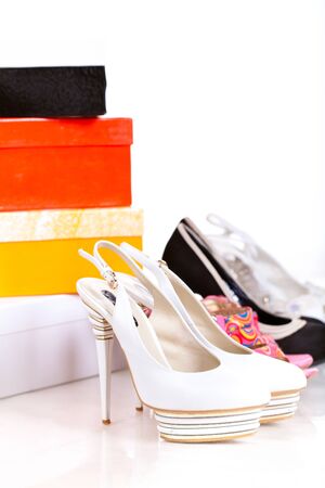 gift boxes and shoes isolated on whiteの写真素材