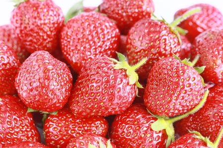 a lot of Fresh red strawberries isolatedの写真素材