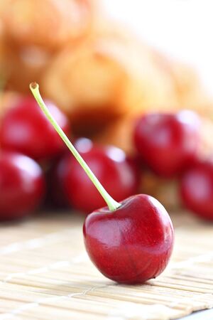Fresh red cherry on wooden tableの写真素材