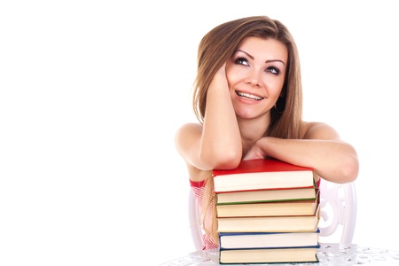 student woman with a stack of books, isolated on whiteの写真素材