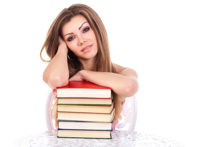student woman with a stack of books, isolated on whiteの写真素材