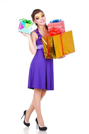 beautiful woman with make up in dress with giftsの写真素材
