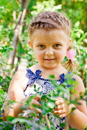 Beautiful Happy Little Girl outdoorの写真素材