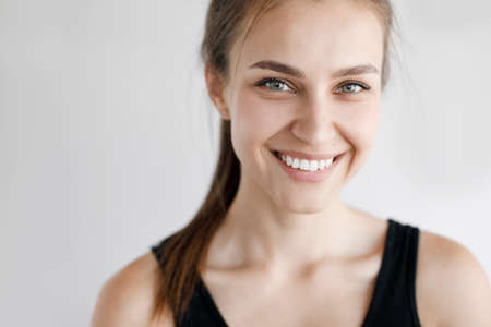 Close up portrait of a woman in studio at homeの写真素材