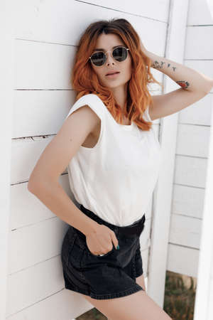 Young smiling happy ginger woman portrait outdoors