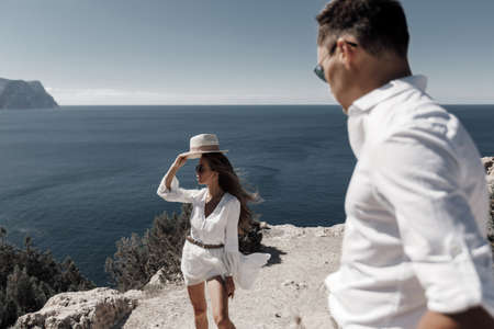 lifestyle engagement photo session young man and woman near yachts, couple in the city