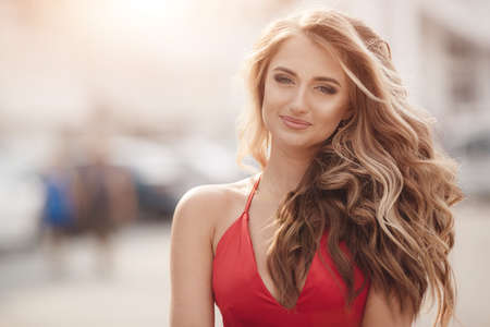 happy fashion woman in red dress outdoor