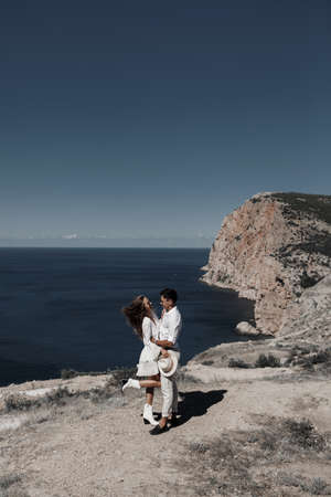 lifestyle engagement photo session young man and woman near yachts, couple in the cityの写真素材