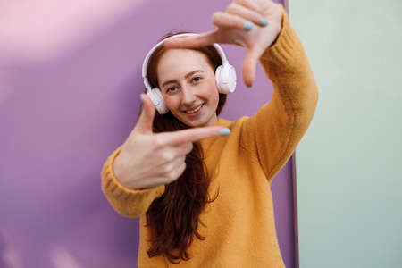 cute woman with headphones outdoor