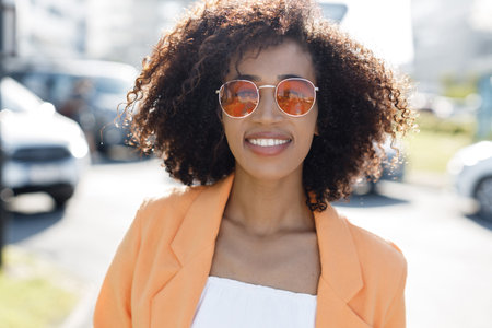 Portrait of a young Smiling African American woman outdoorの写真素材