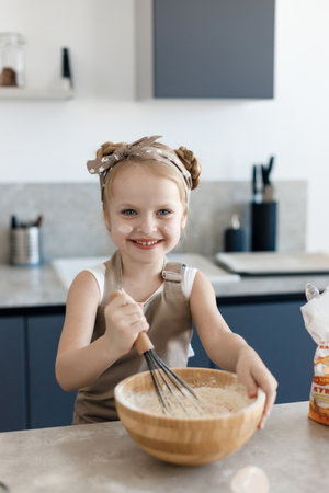 preschool little girl baking at home