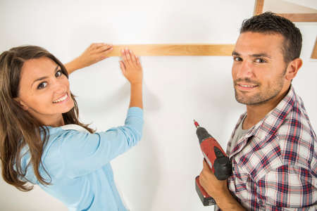 Young couple ready to reform houseの写真素材