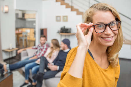 Portrait of beautiful blond woman with eyeglassesの写真素材