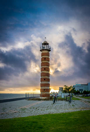 Lighthouse on the coast of the Baltic Sea in Warnemuende, Germanyの写真素材