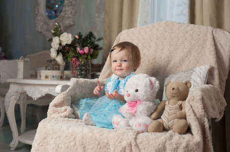 funny baby with teddy bearの写真素材