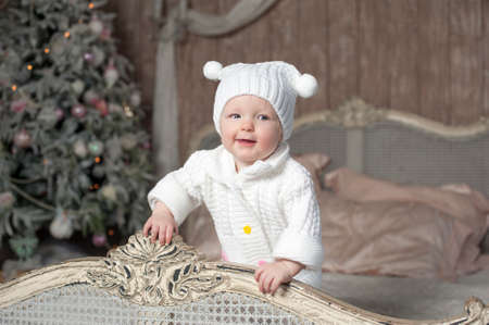 Very funny toddler sitting on the sofaの写真素材