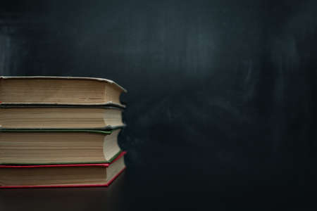 stack of books on a dark background