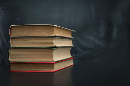 stack of books on a dark backgroundの写真素材