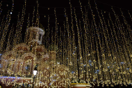 Christmas lights to New Year and holidays. Kazan Cathedral on Red Square. Street decoration in Moscow, Russia. Winter night at city.の写真素材